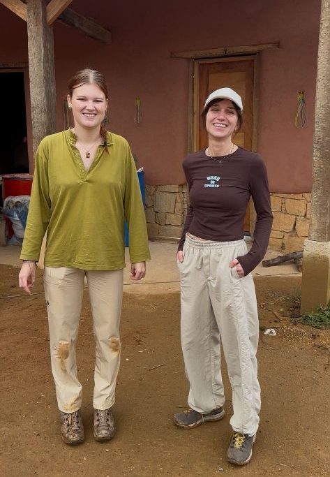 Volunteers Zita and Mirthe working on a natural building project at Eco Caminhos