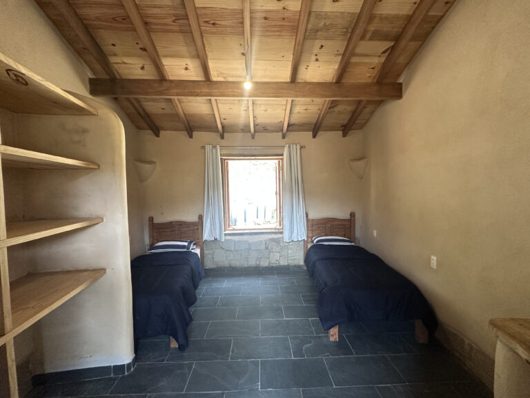 Bedroom built with cob and stone natural materials in a bioconstruction house Brazil