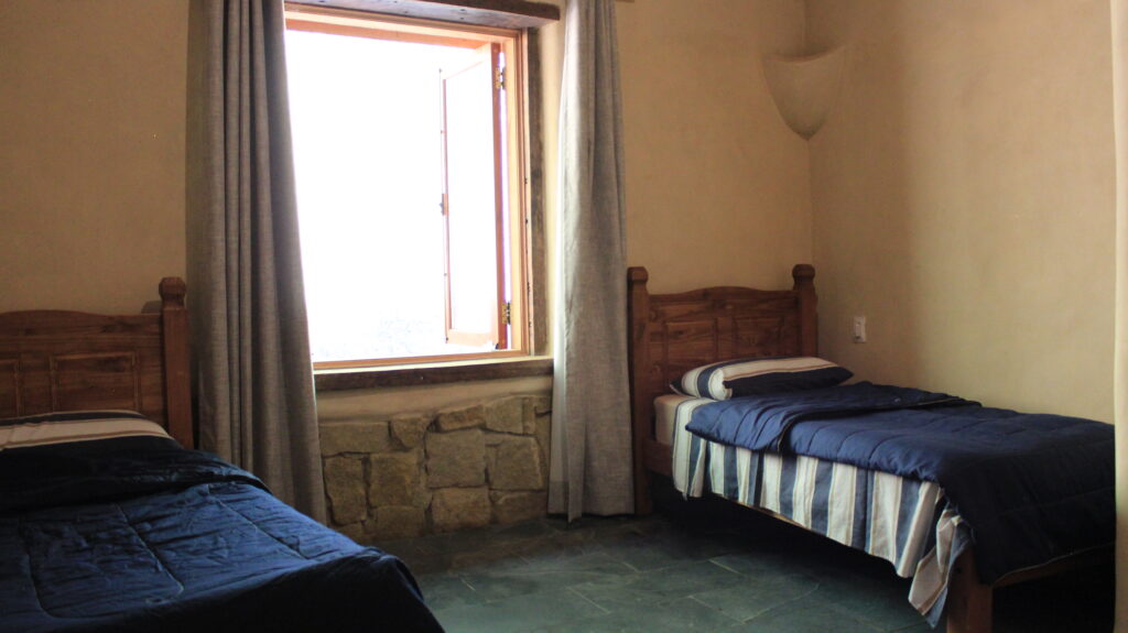 Bedroom built with cob and stone natural materials in a bioconstruction house Brazil