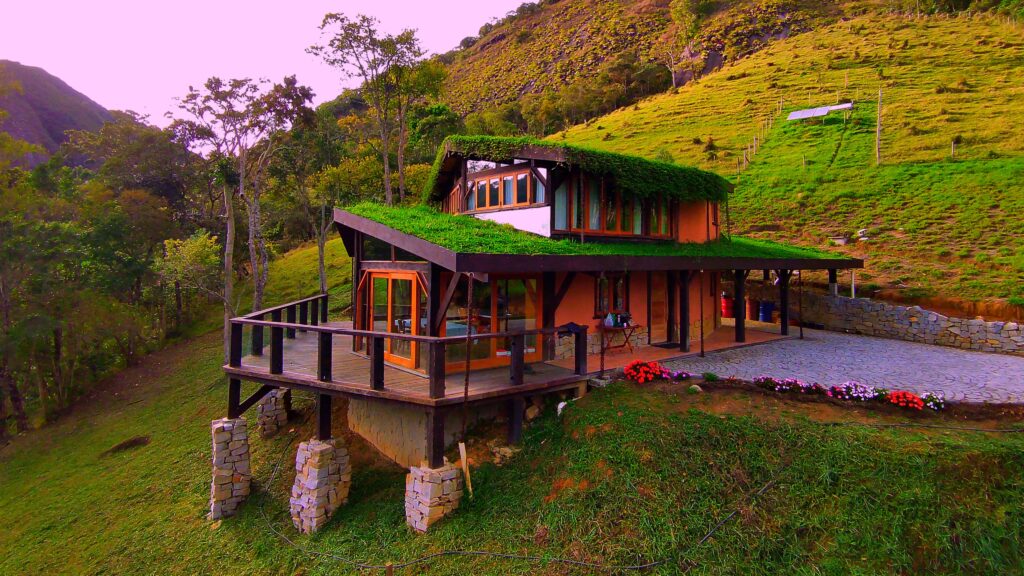 Front facade of a luxury home built with natural building techniques at Eco Caminhos.