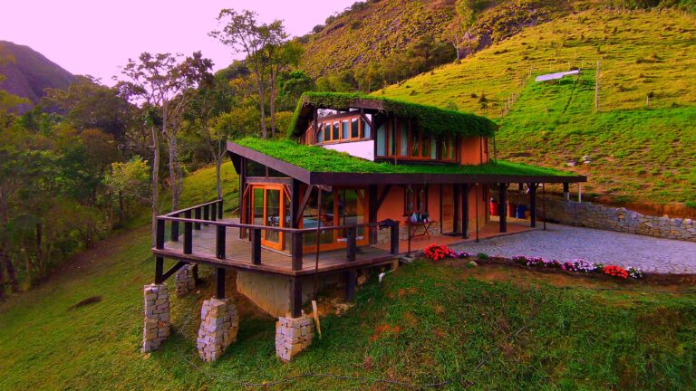 Front facade of a luxury home built with natural building techniques at Eco Caminhos.