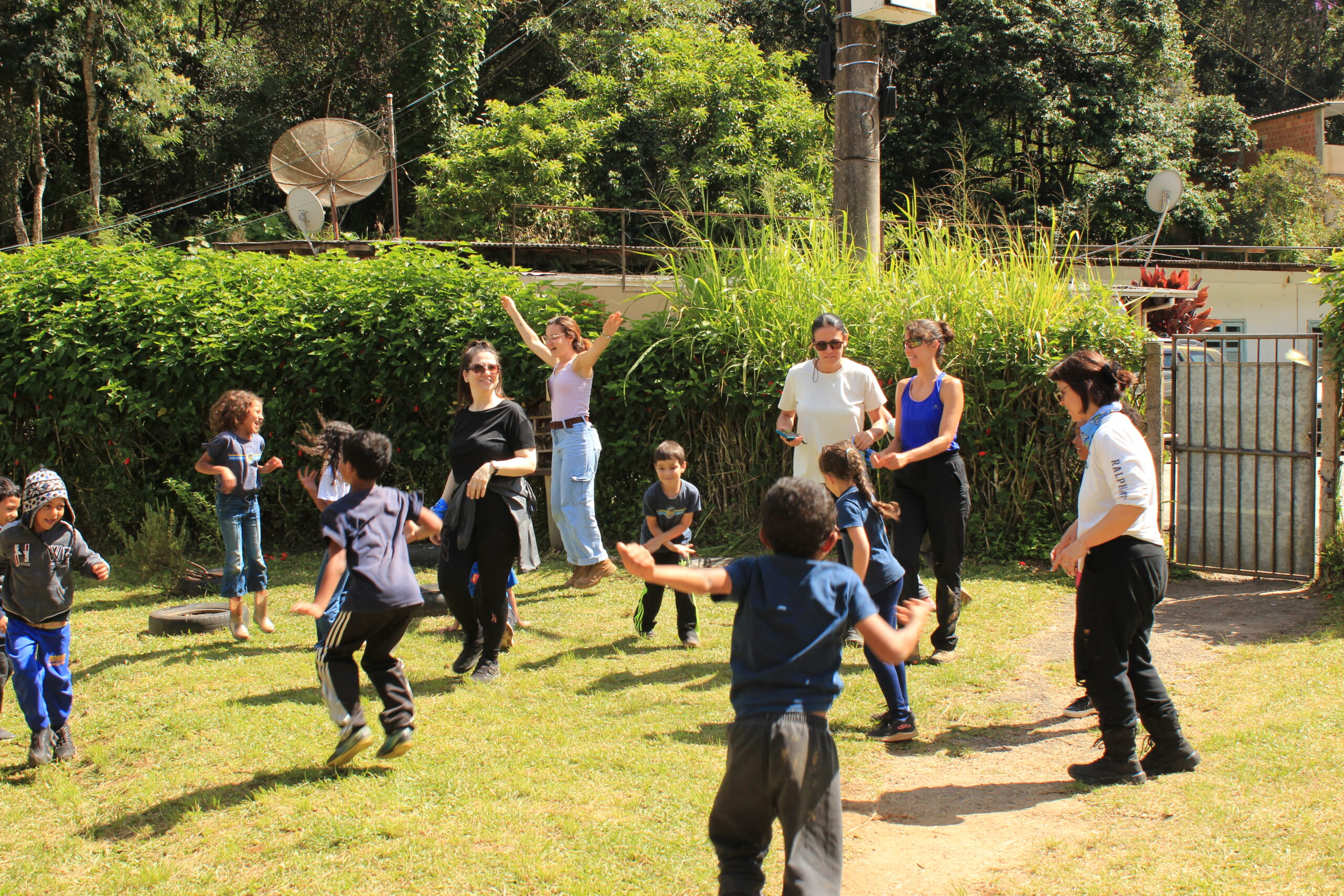 International students and volunteers playing with children at a local school in Brazil.