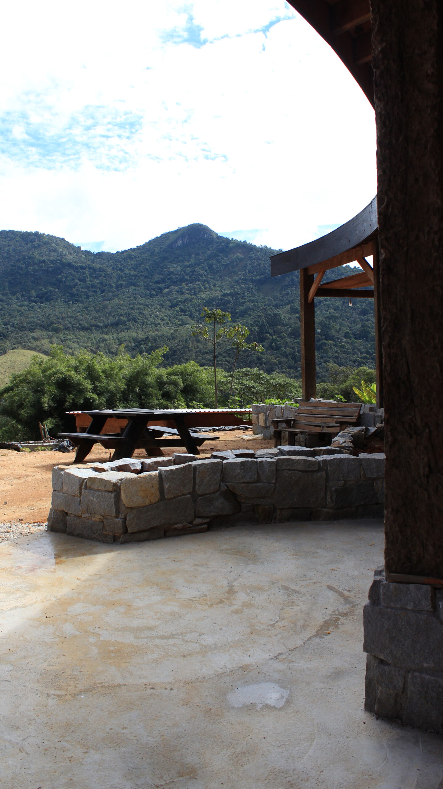 Beautiful sustainable kitchen and dining room with mountain view at an eco farm in Brazil