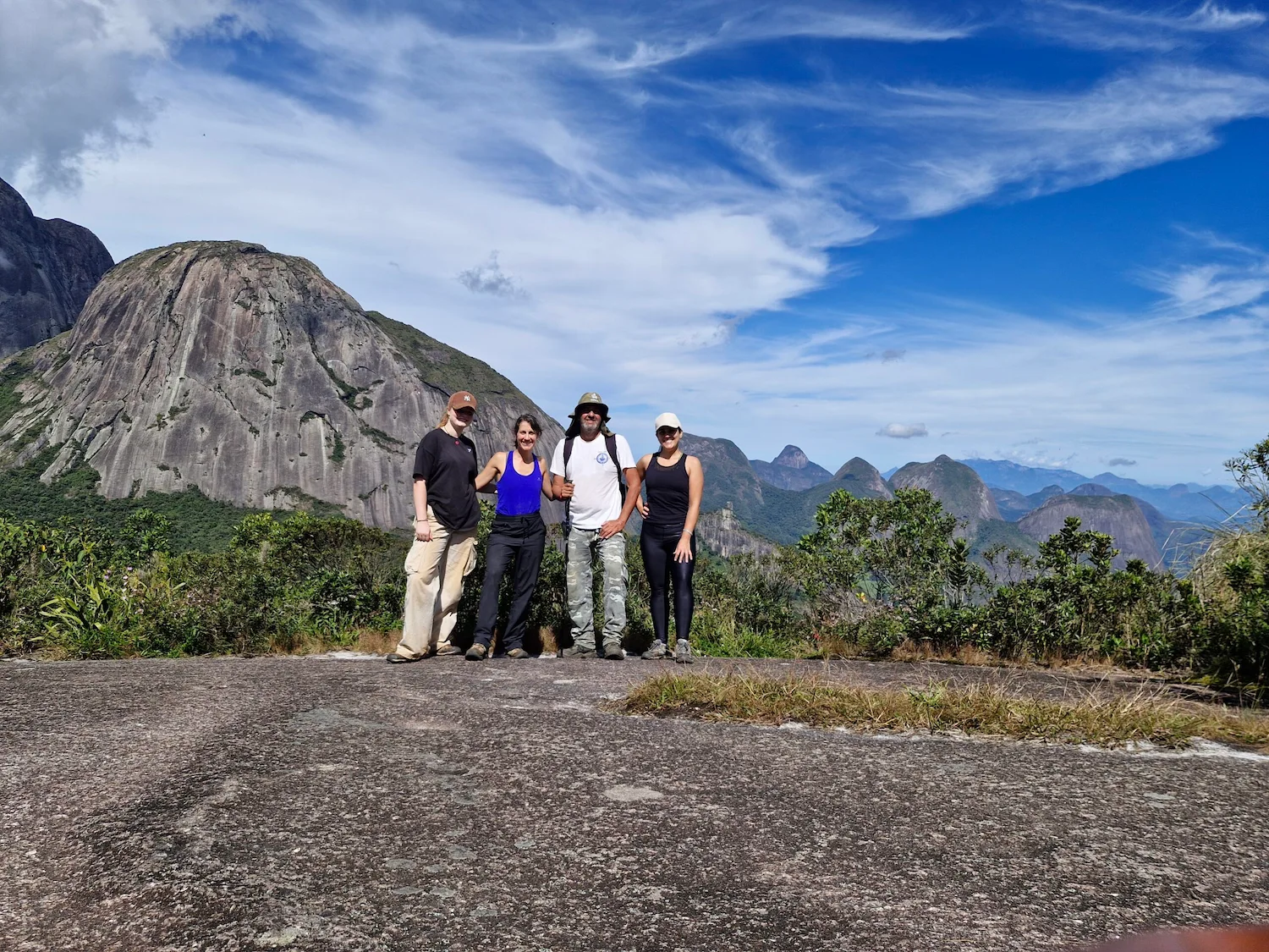 Volunteers posing for a group photo during a hiking trail in the Atlantic Forest, Brazil.