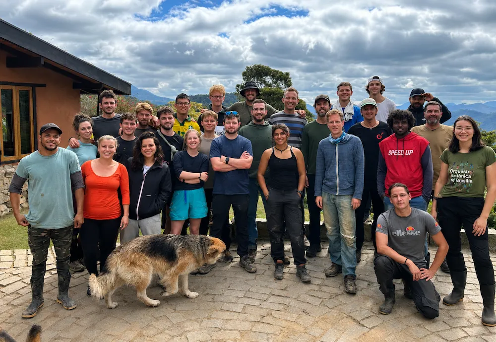Volunteers, staff, and community members gathered together at Eco Caminhos in Brazil.