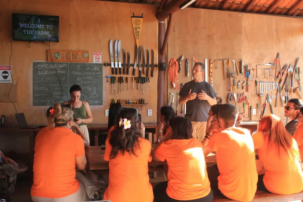 International volunteers receiving guidance before starting their eco village volunteer experience in Brazil.