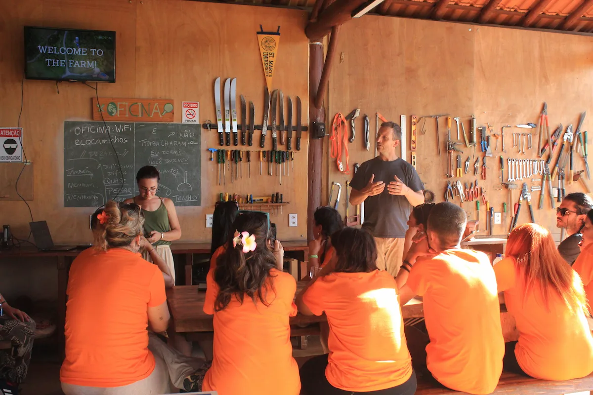 International volunteers receiving guidance before starting their eco village volunteer experience in Brazil.